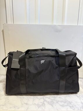 NWT Fabletics The Convertible Travel Bag black duffle garment nylon gym weekend